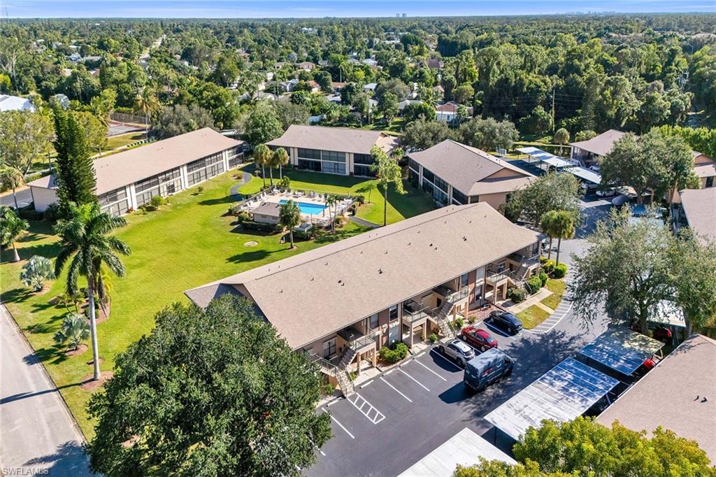 236 Pebble Beach Circle, Unit A102 Naples, FL 34113 - Photo 38 of 40 an aerial view of a house with a garden