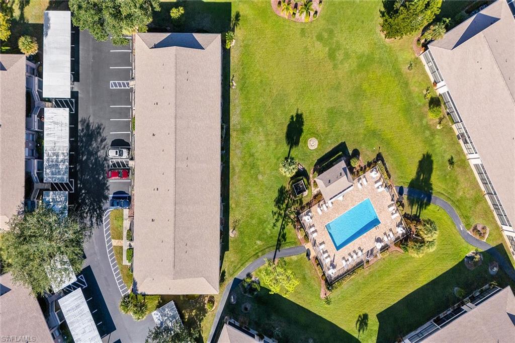236 Pebble Beach Circle, Unit A102 Naples, FL 34113 - Photo 39 of 40 aerial view of a house with swimming pool