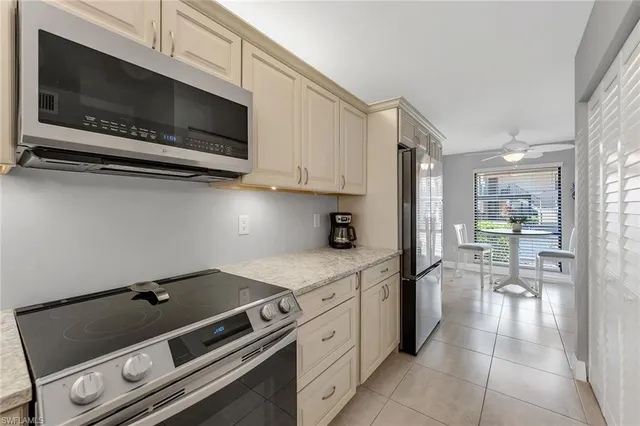 a kitchen with a stove and a microwave