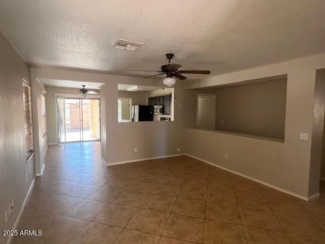 a view of a kitchen with a sink and a window