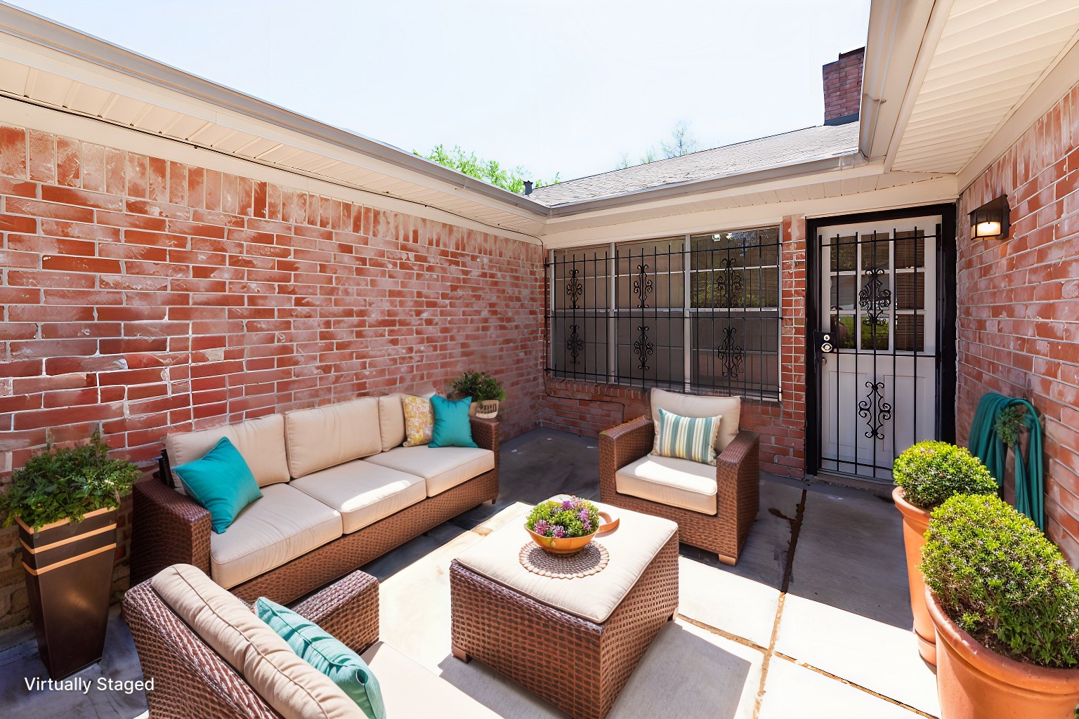 8826 Roos Road Houston, TX 77036 - Photo 36 of 42 Charming brick patio with cozy outdoor seating, vibrant cushions, and potted plants. Ideal for relaxing or entertaining.