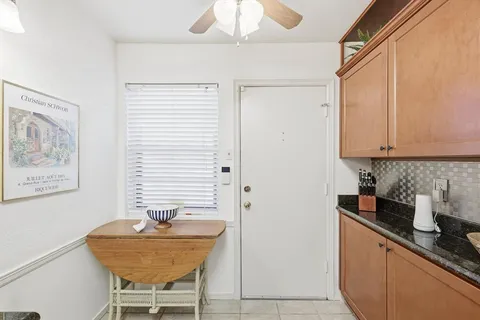 a kitchen with stainless steel appliances granite countertop a sink and a refrigerator