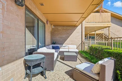 a view of a backyard with sitting area