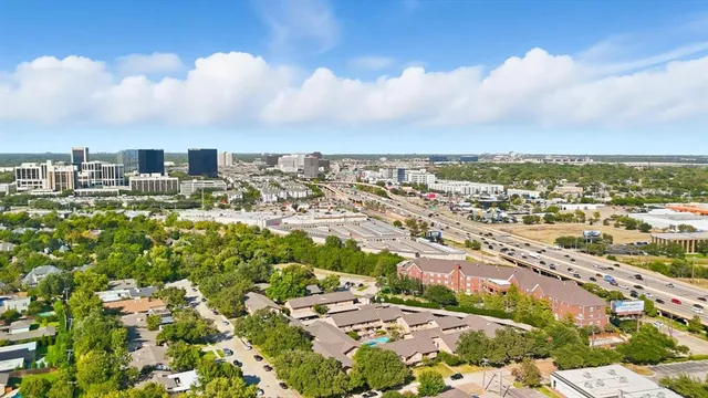 an aerial view of residential building with yard