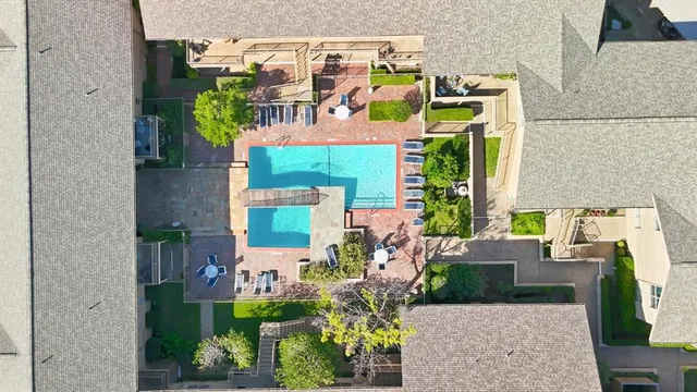 swimming pool view with outdoor seating