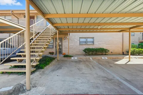 a view of a house with a street