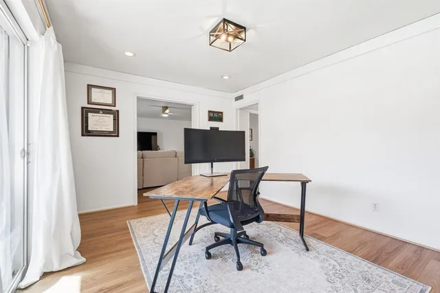 a workspace with furniture and wooden floor