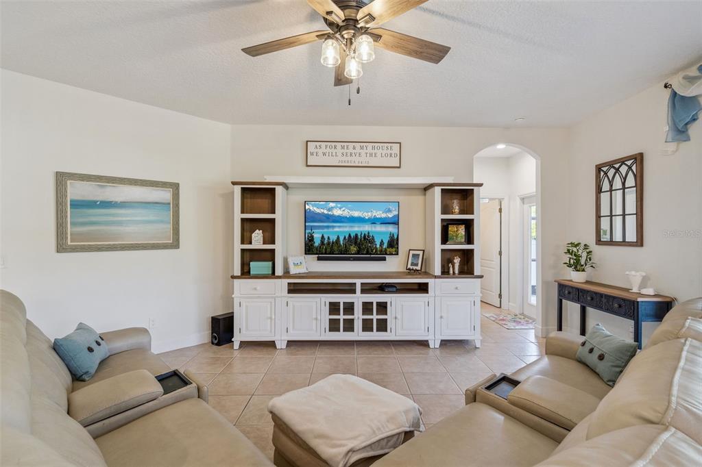 1471 Wescott Loop Winter Springs, FL 32708 - Photo 12 of 57 a living room with furniture and a flat screen tv