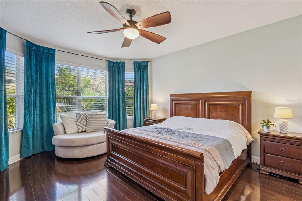 1471 Wescott Loop Winter Springs, FL 32708 - Photo 20 of 57 a bedroom with a large bed and a couch