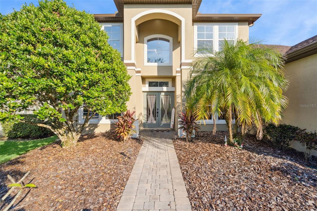 1471 Wescott Loop Winter Springs, FL 32708 - Photo 2 of 57 a front view of a house with garden