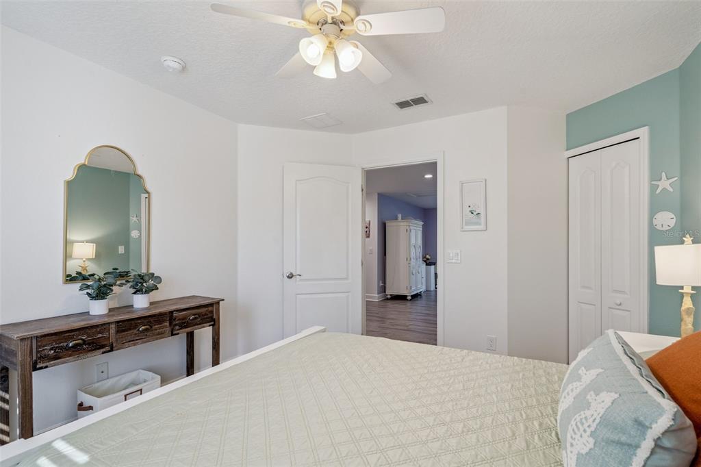 1471 Wescott Loop Winter Springs, FL 32708 - Photo 28 of 57 a bedroom with a bed and a dresser