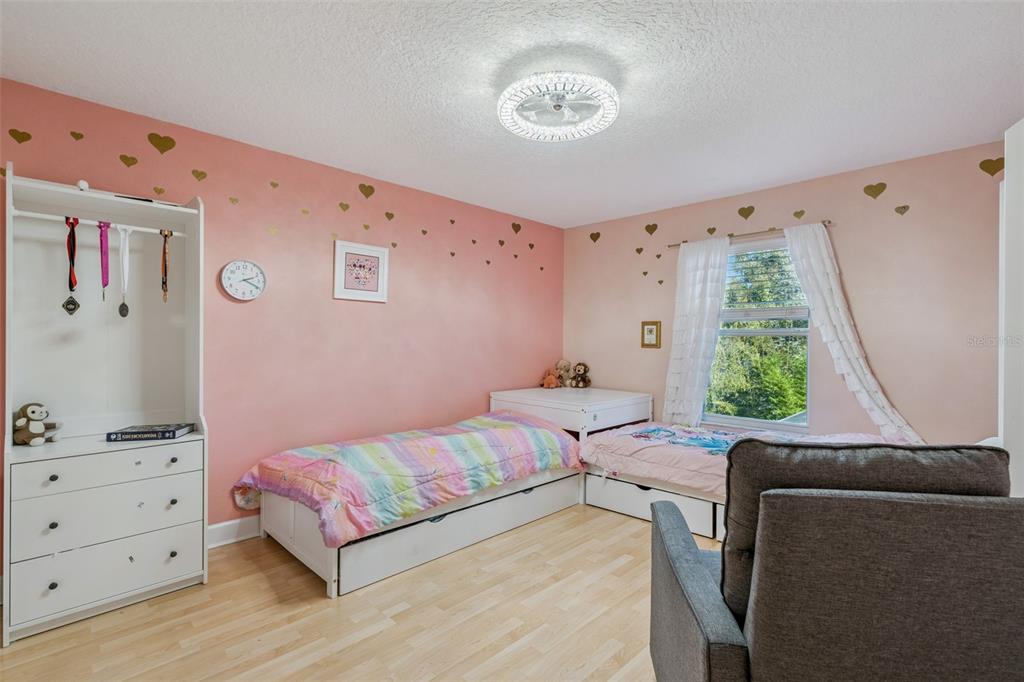 1471 Wescott Loop Winter Springs, FL 32708 - Photo 29 of 57 a bedroom with a bed and a window