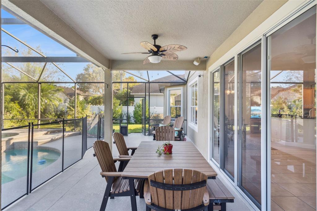 1471 Wescott Loop Winter Springs, FL 32708 - Photo 39 of 57 a dining room with furniture a chandelier and wooden floor
