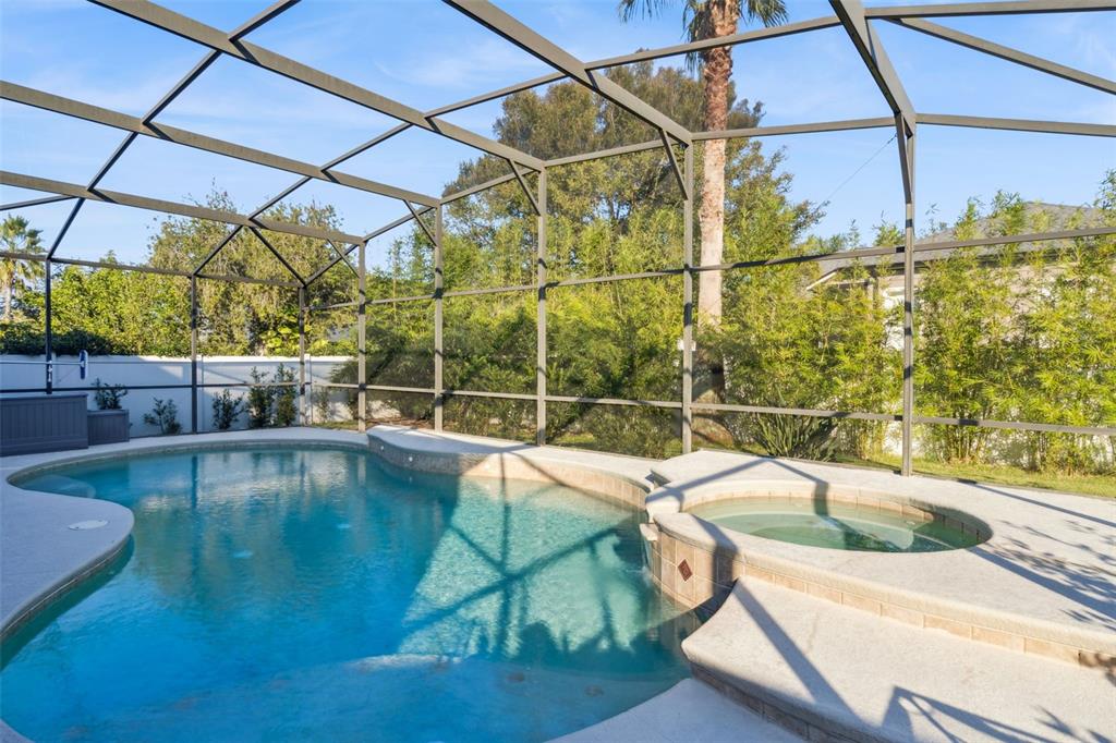 1471 Wescott Loop Winter Springs, FL 32708 - Photo 42 of 57 a view of a swimming pool with a patio