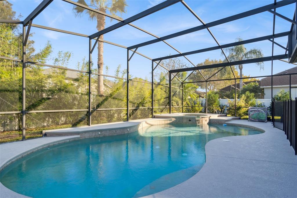 1471 Wescott Loop Winter Springs, FL 32708 - Photo 43 of 57 a view of a swimming pool with a porch