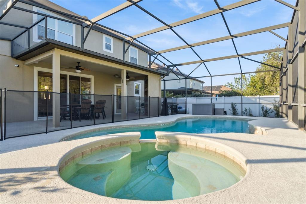 1471 Wescott Loop Winter Springs, FL 32708 - Photo 45 of 57 a view of a swimming pool with a couches in patio