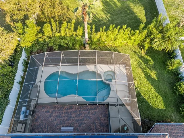 an aerial view of residential building with parking space