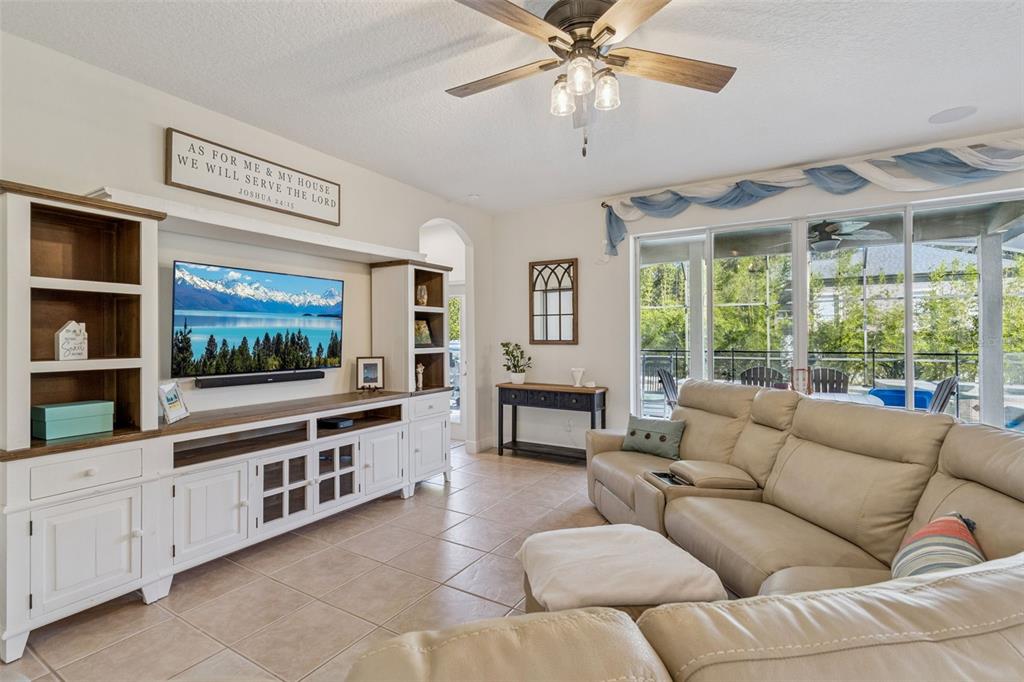 1471 Wescott Loop Winter Springs, FL 32708 - Photo 9 of 57 a living room with furniture and a flat screen tv
