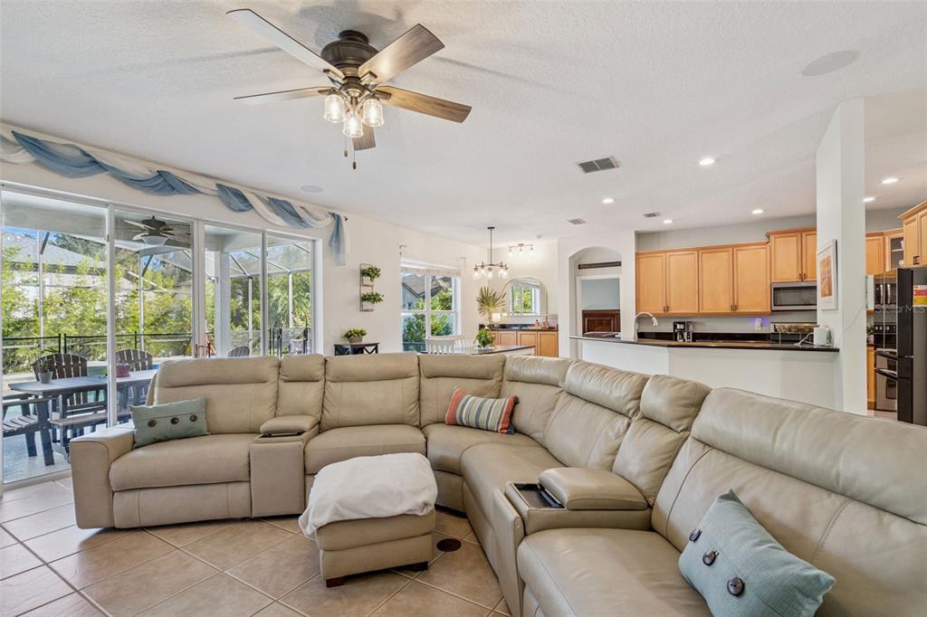 1471 Wescott Loop Winter Springs, FL 32708 - Photo 10 of 57 a living room with furniture ceiling fan and a large window