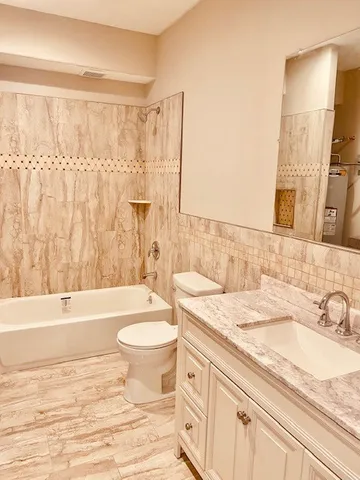 a bathroom with a sink a toilet and a bathtub