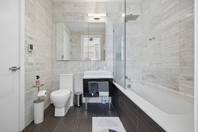 a view of a dining room with furniture and a potted plant