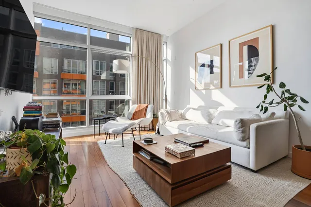 a bathroom with a bathtub shower sink vanity and toilet