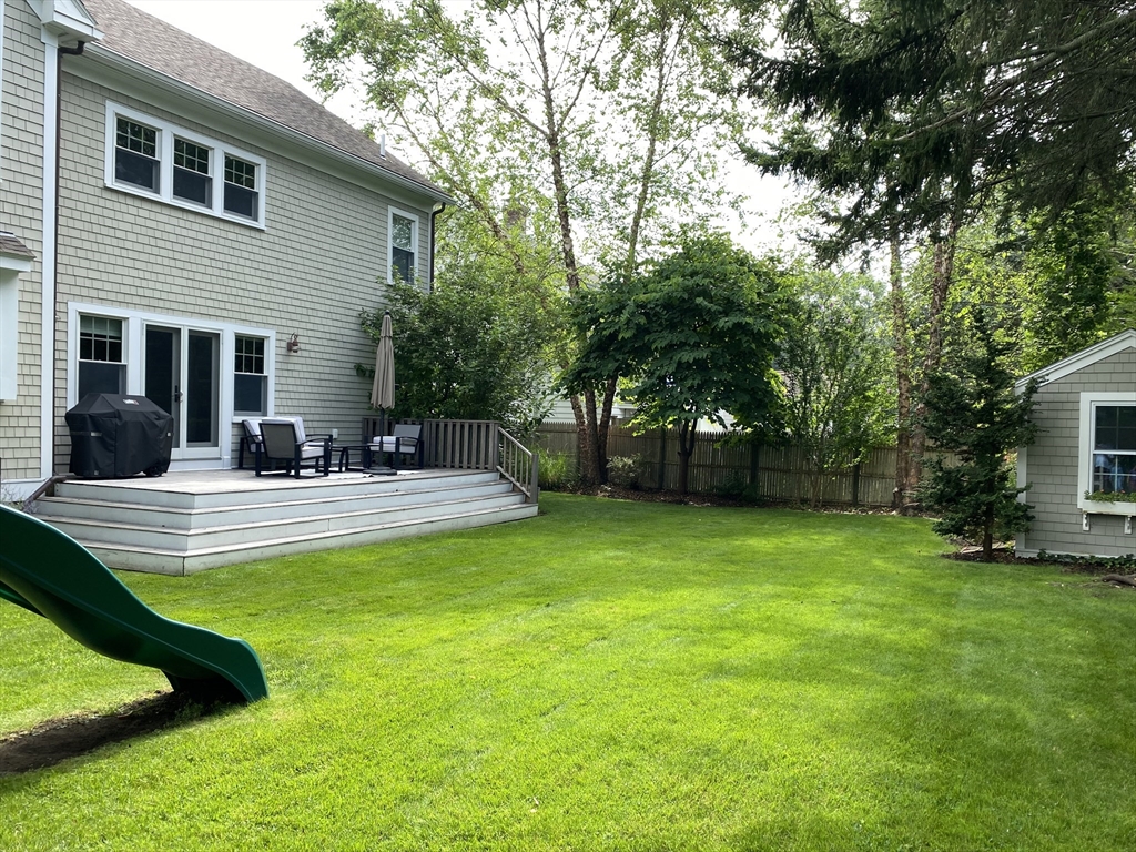 31 Bubier Road Marblehead, MA 01945 - Photo 28 of 29 a view of a patio with table and chairs potted plants and large tree