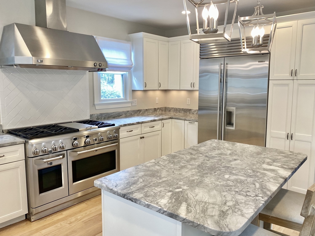 31 Bubier Road Marblehead, MA 01945 - Photo 4 of 29 a kitchen with a stove and a refrigerator