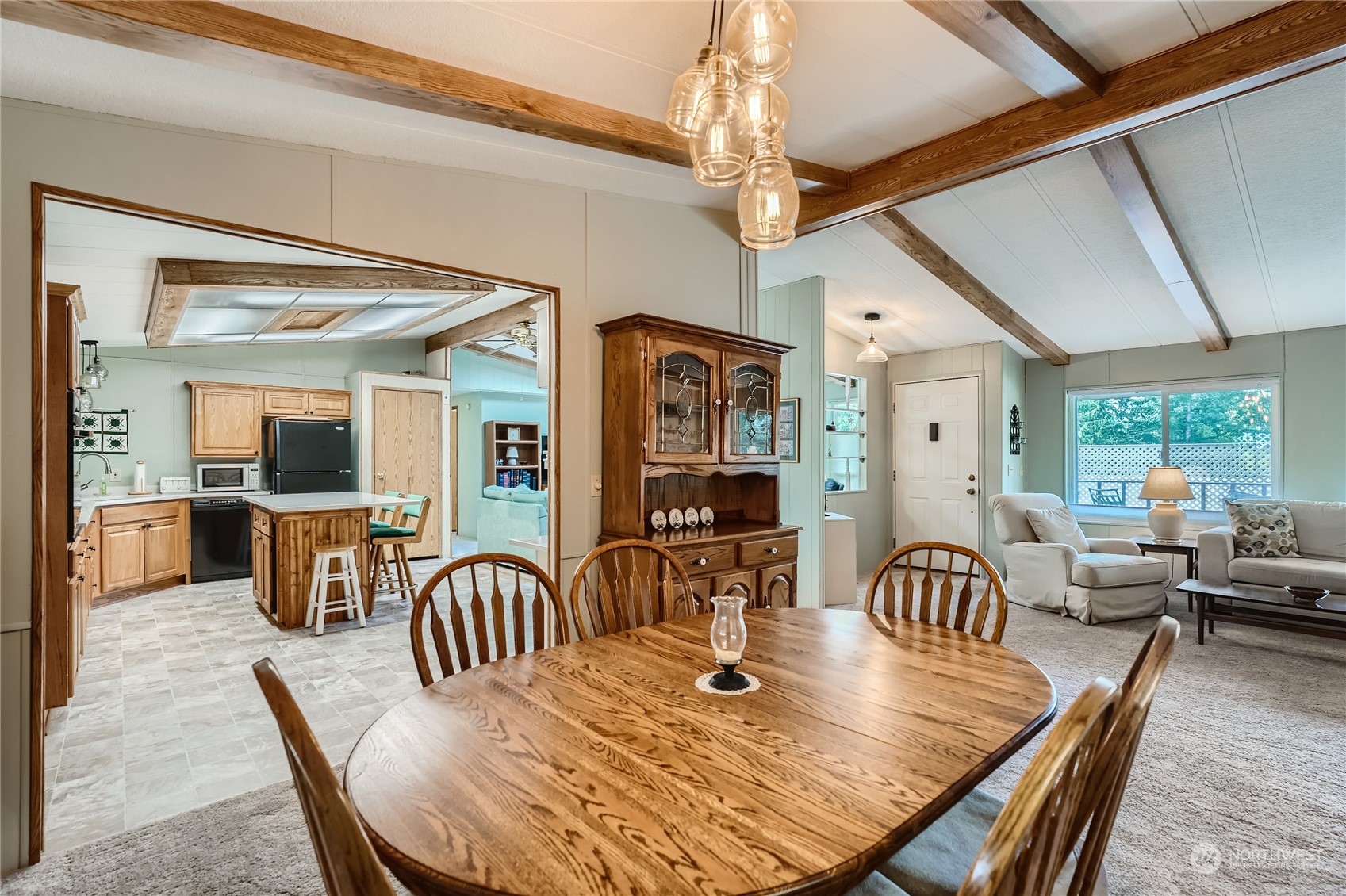 2500 South 370th Street, Unit 196 Federal Way, WA 98003 - Photo 11 of 29 a view of a dining room with furniture window and wooden floor