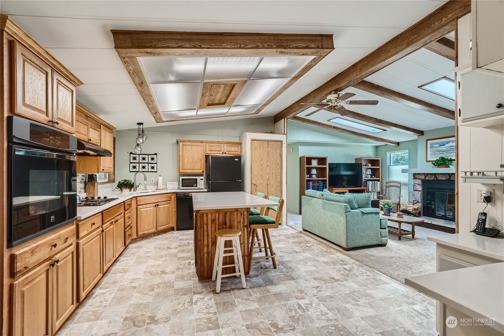 2500 South 370th Street, Unit 196 Federal Way, WA 98003 - Photo 13 of 29 a kitchen with furniture and a view of living room