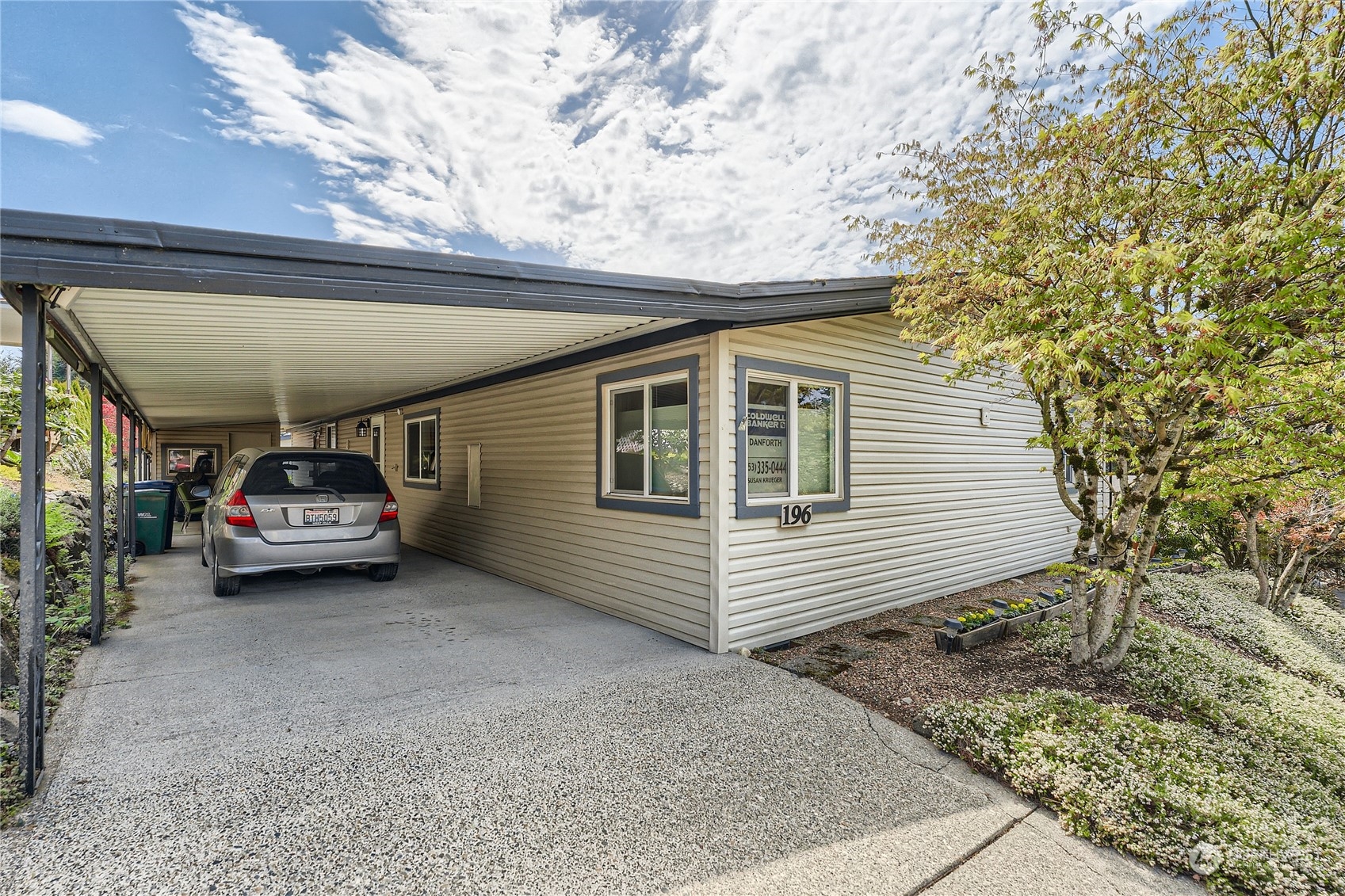 2500 South 370th Street, Unit 196 Federal Way, WA 98003 - Photo 2 of 29 a car parked in front of a house