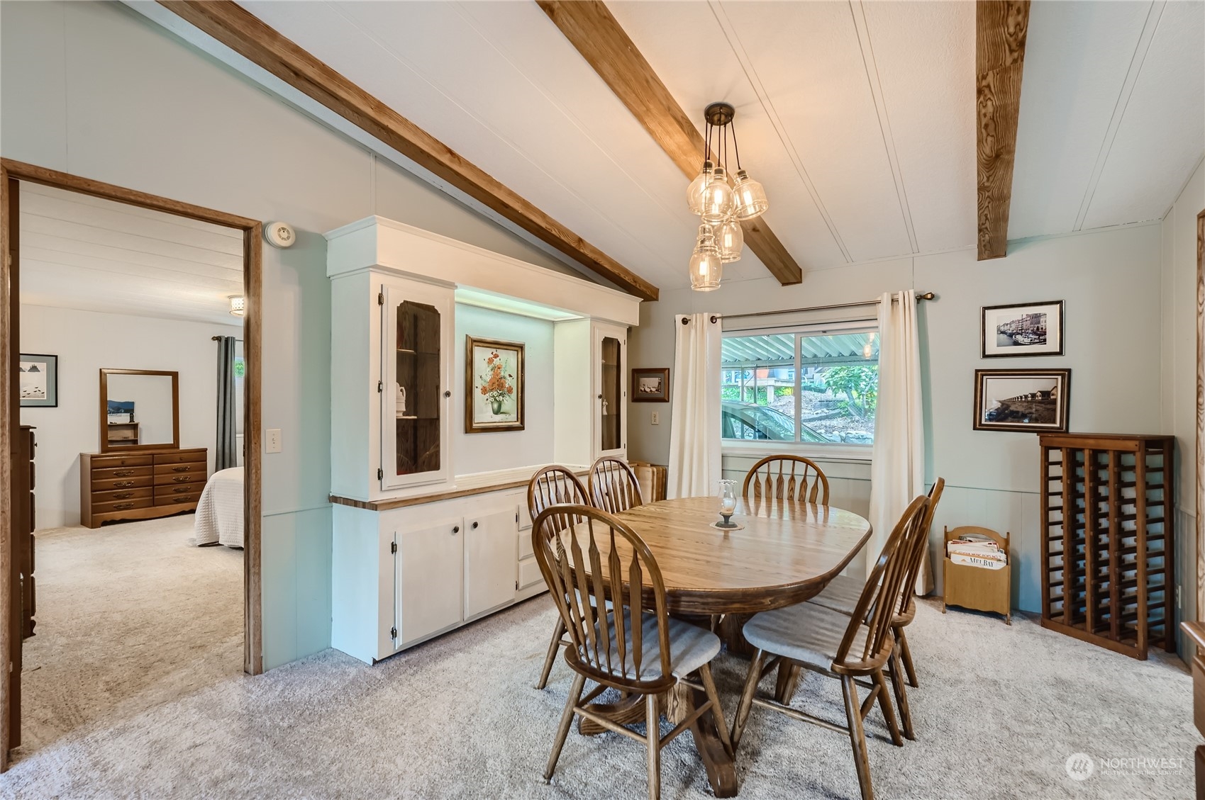 2500 South 370th Street, Unit 196 Federal Way, WA 98003 - Photo 9 of 29 a view of a dining room with furniture window and wooden floor