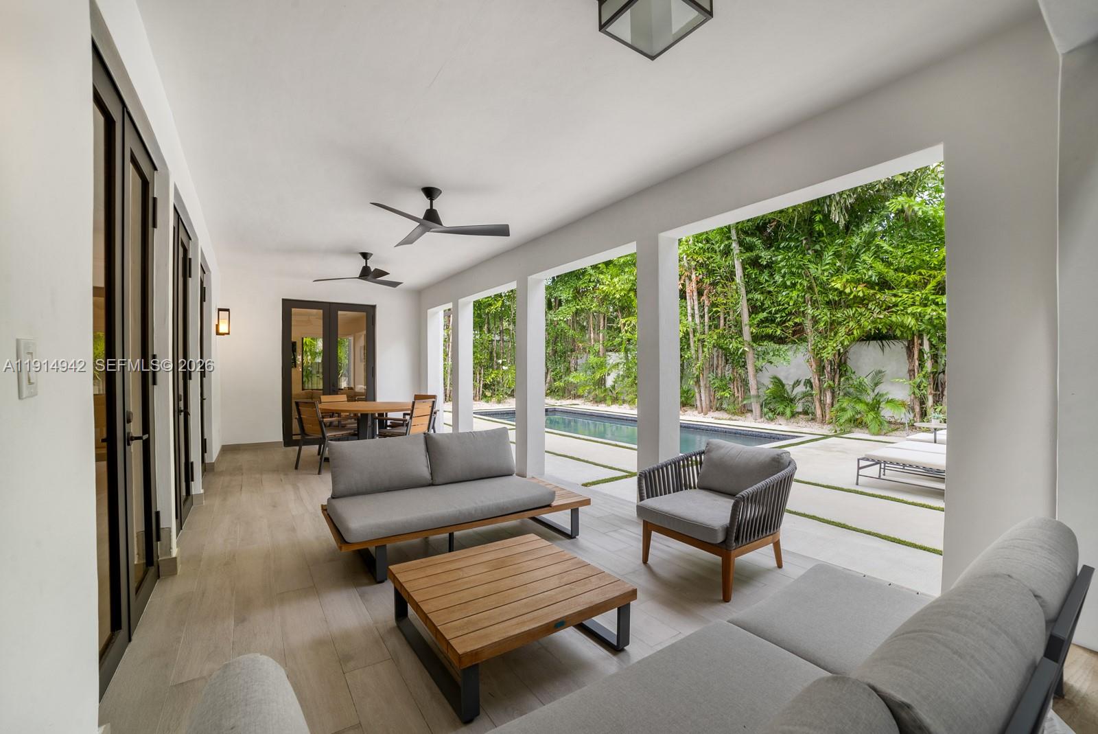 5735 North Bay Road Miami Beach, FL 33140 - Photo 20 of 59 a living room with furniture and a large window