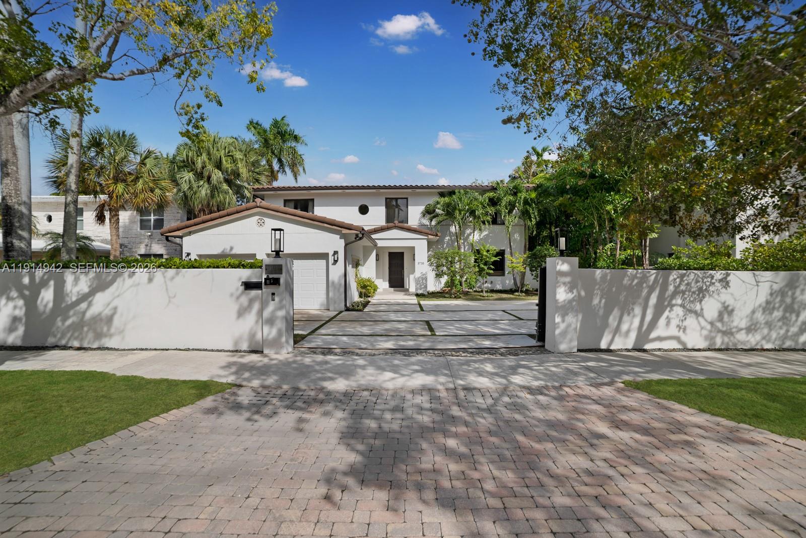 5735 North Bay Road Miami Beach, FL 33140 - Photo 2 of 59 a view of a house with a yard