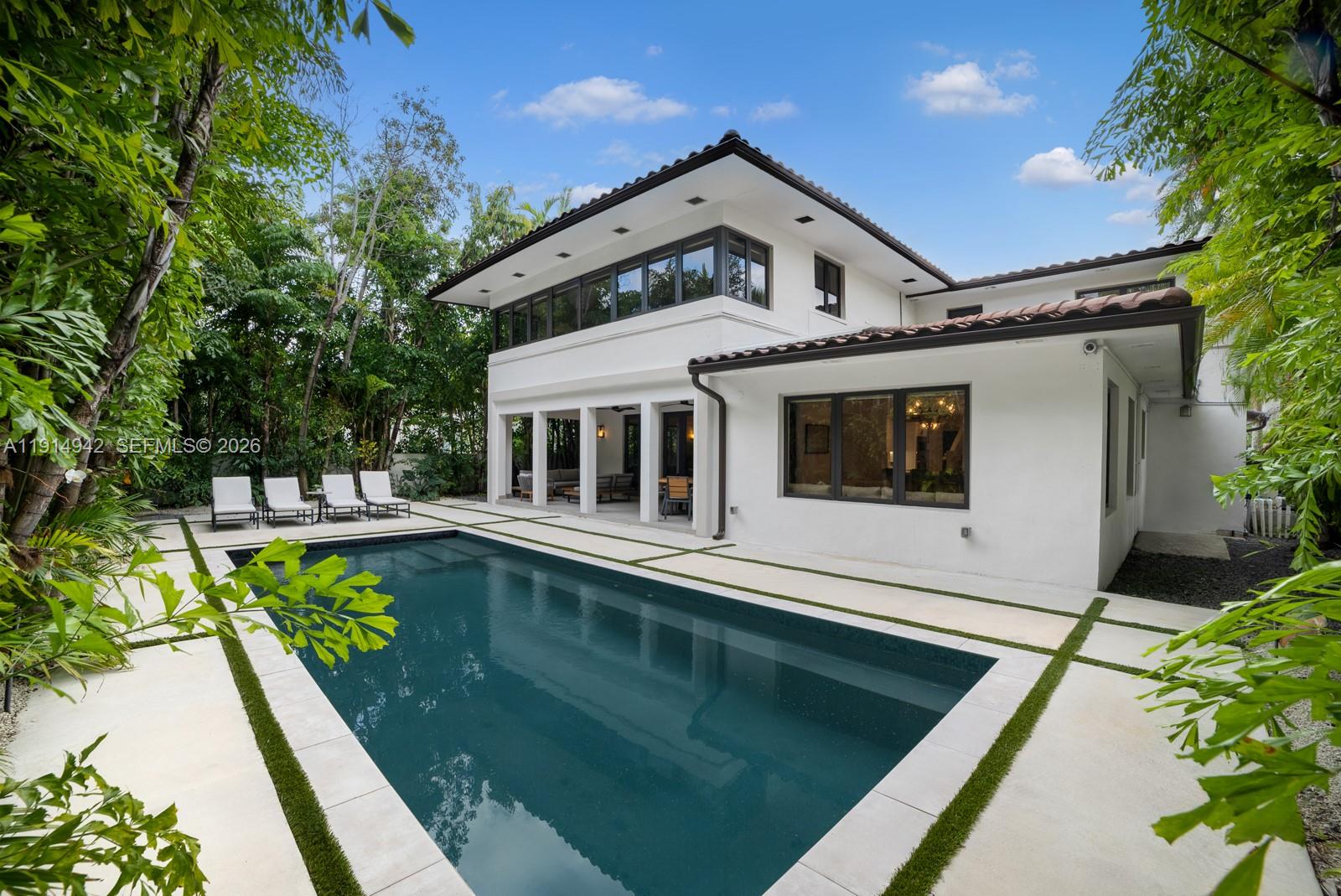 5735 North Bay Road Miami Beach, FL 33140 - Photo 25 of 59 a front view of a house with swimming pool