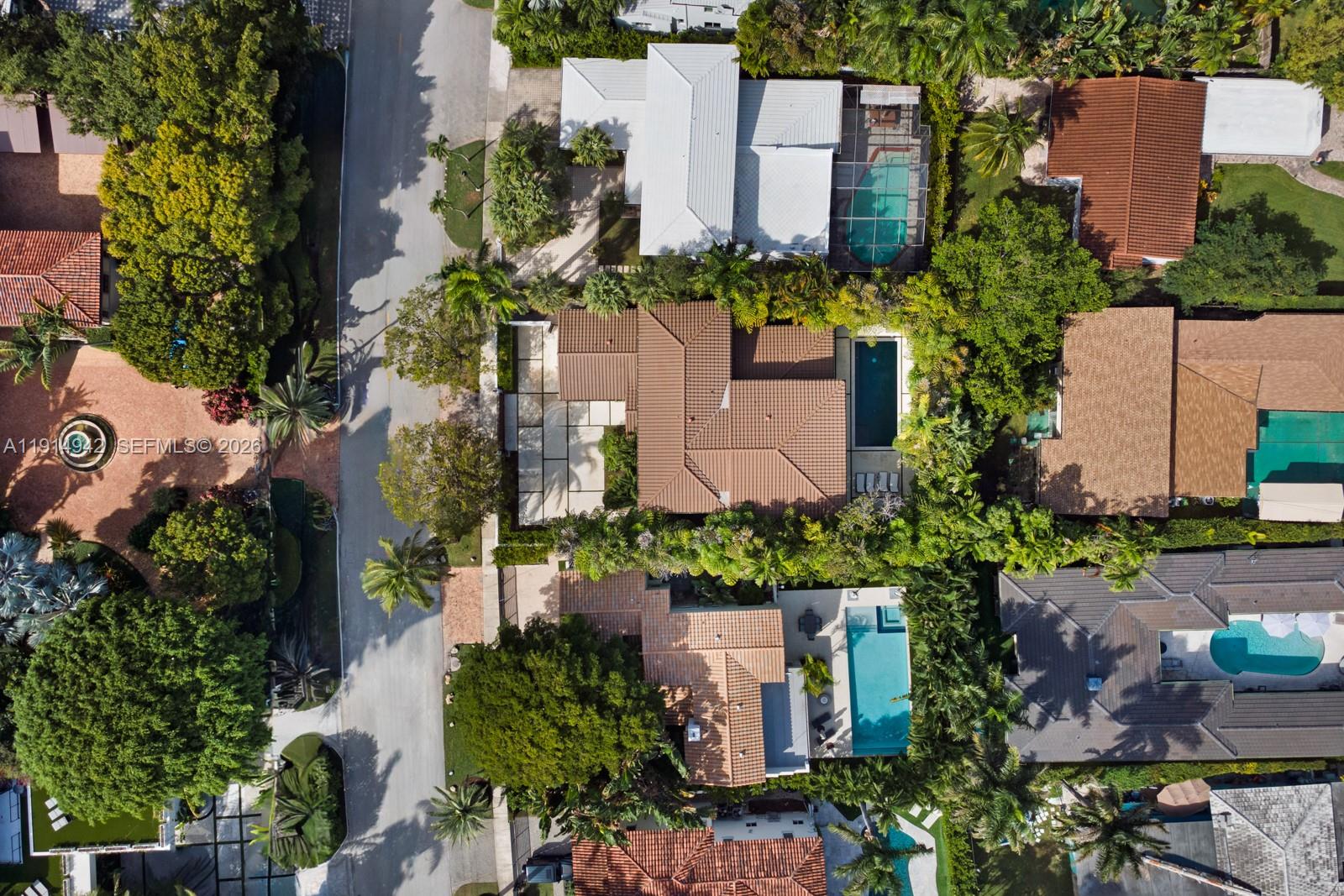 5735 North Bay Road Miami Beach, FL 33140 - Photo 51 of 59 an aerial view of a house with a yard and garden