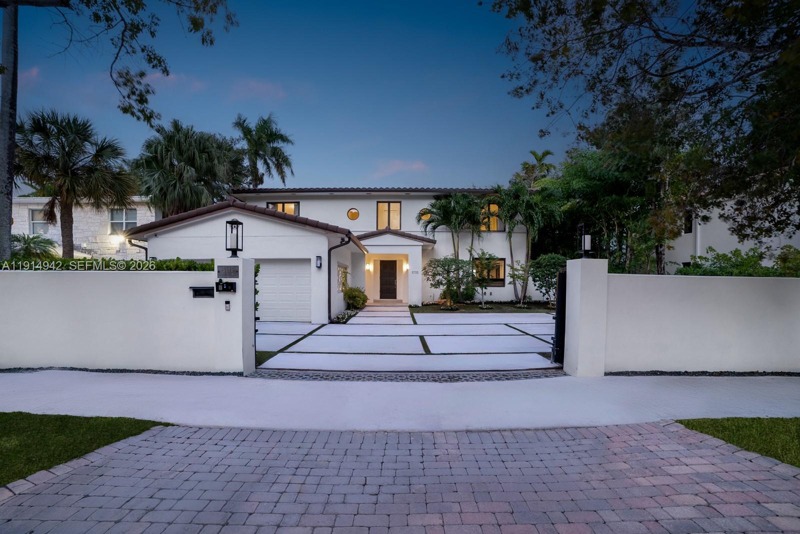 5735 North Bay Road Miami Beach, FL 33140 - Photo 53 of 59 a view of a house with a yard