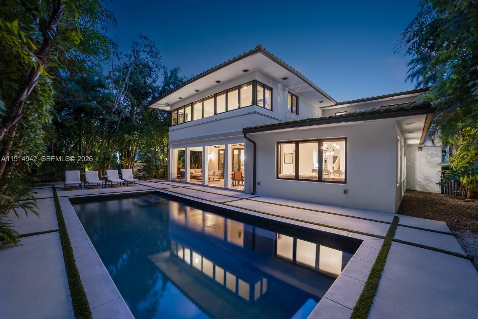 5735 North Bay Road Miami Beach, FL 33140 - Photo 56 of 59 front view of a house with a swimming pool