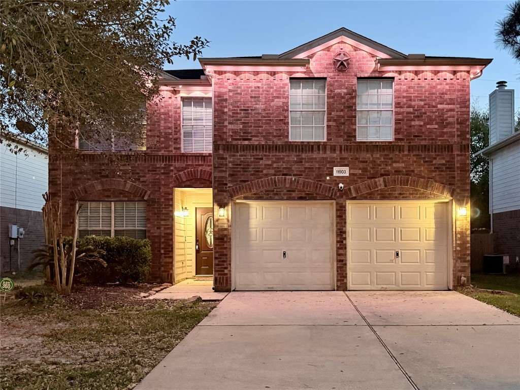 11903 Ezekiel Road Tomball, TX 77375 - Photo 1 of 39 a front view of a house with a yard