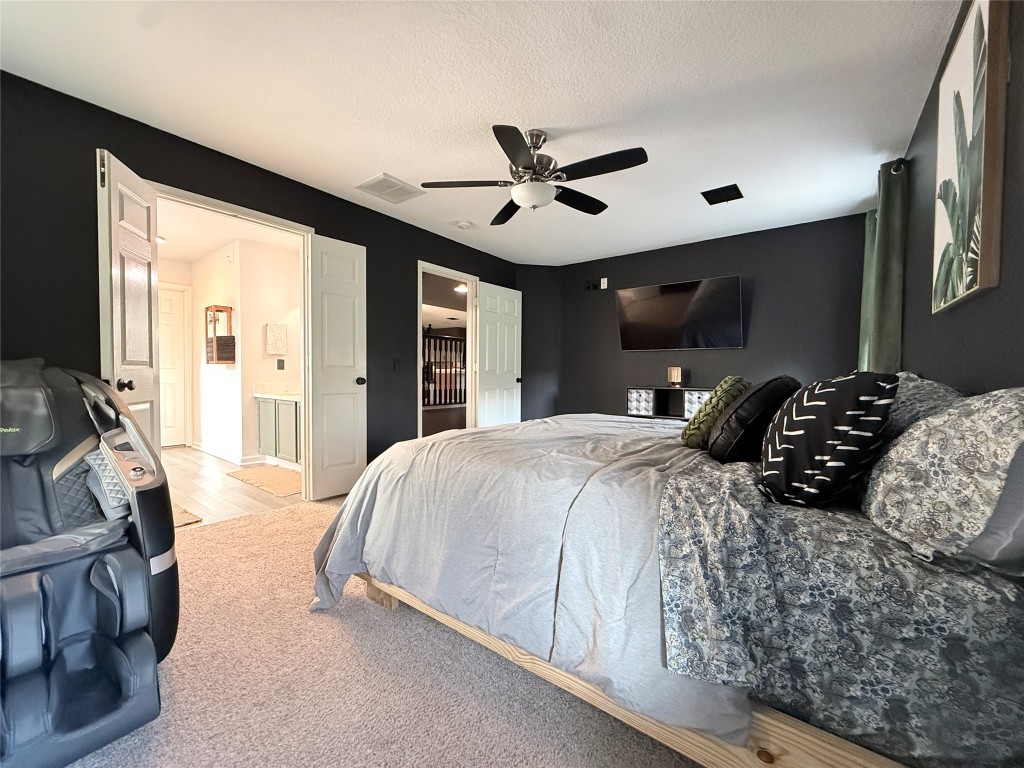 11903 Ezekiel Road Tomball, TX 77375 - Photo 12 of 39 a bedroom with a large bed and a large window