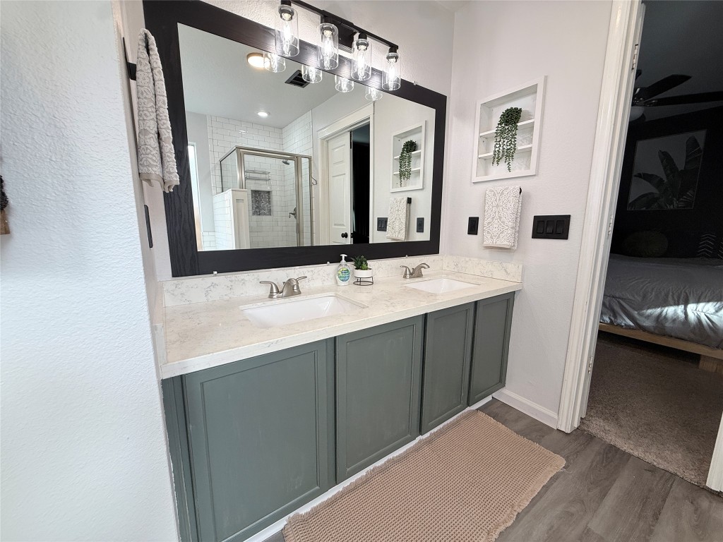 11903 Ezekiel Road Tomball, TX 77375 - Photo 24 of 39 a bathroom with a sink vanity and mirror