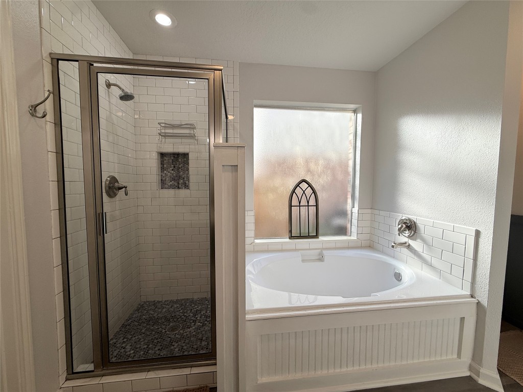 11903 Ezekiel Road Tomball, TX 77375 - Photo 25 of 39 a bathroom with a bathtub and shower