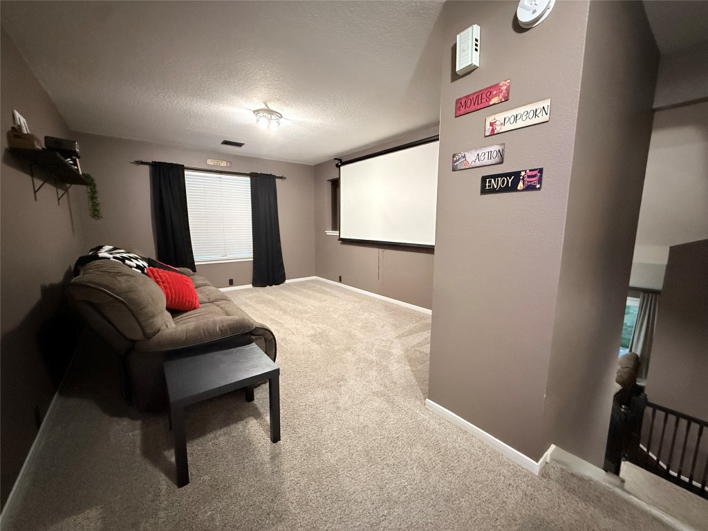 11903 Ezekiel Road Tomball, TX 77375 - Photo 28 of 39 a bedroom with a bed and a flat screen tv