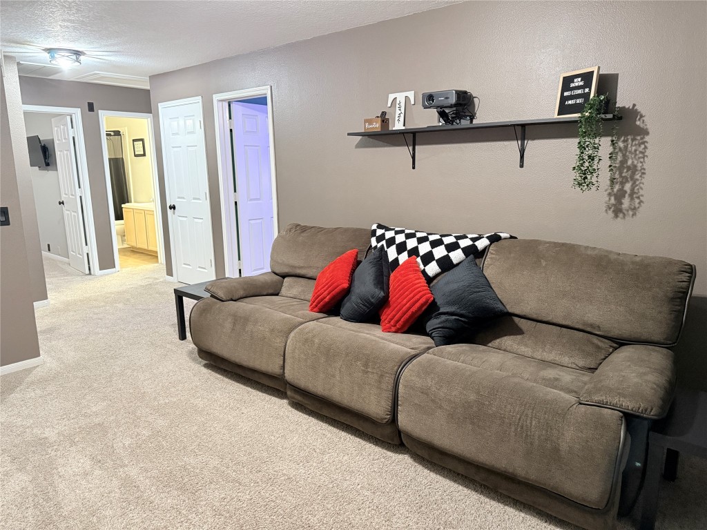 11903 Ezekiel Road Tomball, TX 77375 - Photo 30 of 39 a living room with furniture and a wall painting