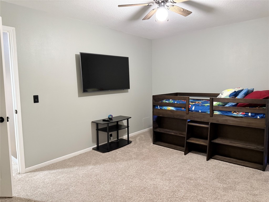 11903 Ezekiel Road Tomball, TX 77375 - Photo 33 of 39 a living room with furniture and a flat screen tv