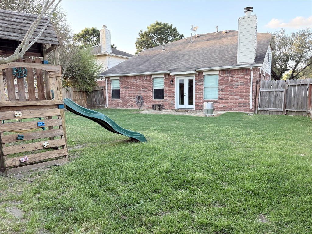 11903 Ezekiel Road Tomball, TX 77375 - Photo 38 of 39 front view of a house with a yard