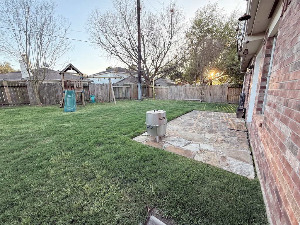11903 Ezekiel Road Tomball, TX 77375 - Photo 39 of 39 a view of a white house next to a yard with big trees and plants