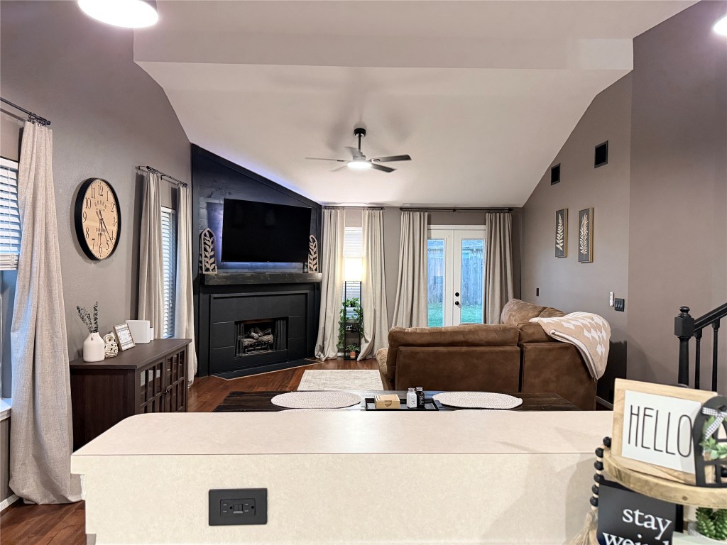 11903 Ezekiel Road Tomball, TX 77375 - Photo 9 of 39 a living room with furniture a fireplace and a flat screen tv