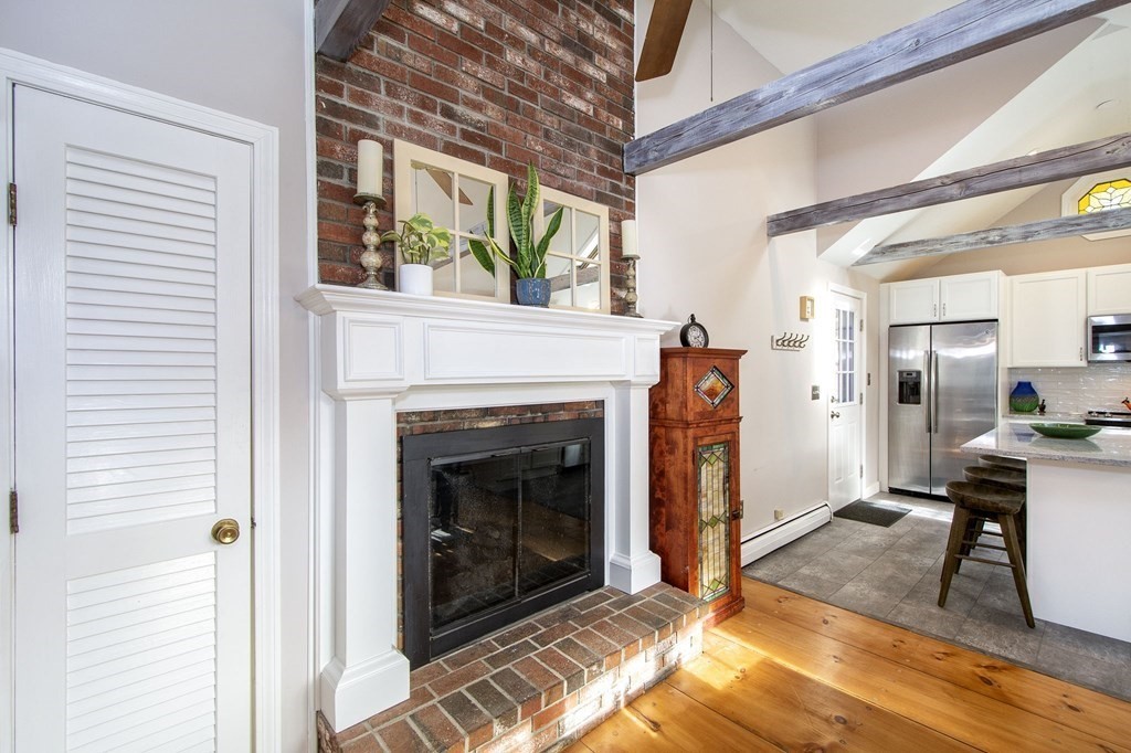 32 Shadwell Road Scituate, MA 02066 - Photo 11 of 32 a view of a livingroom with furniture and a fireplace