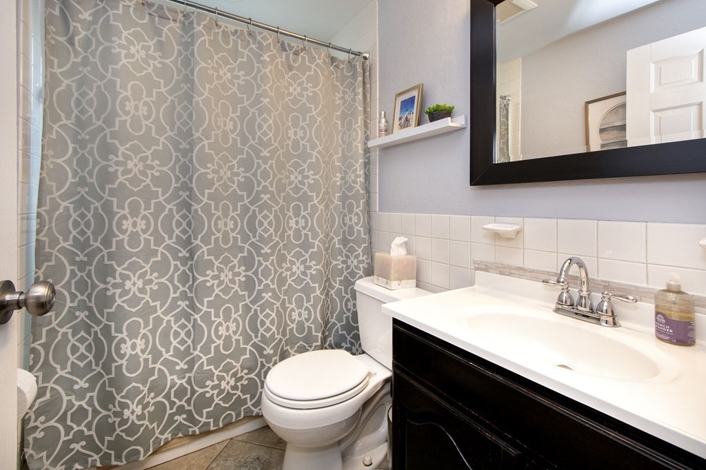 32 Shadwell Road Scituate, MA 02066 - Photo 21 of 32 a bathroom with a sink toilet and mirror